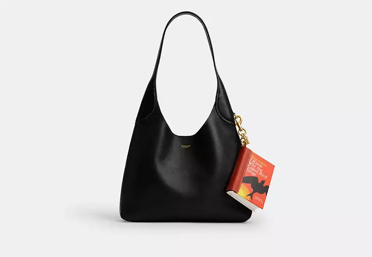 COACHA privjesak za torbu u obliku knjige marie claire hrvatska